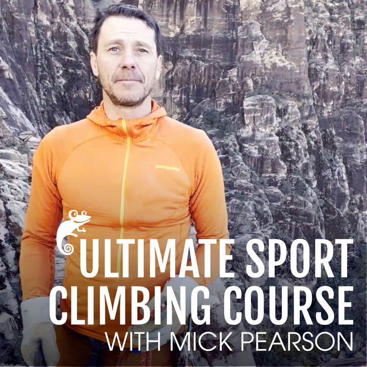 Mick Pearson smiling with grey cliffs in background